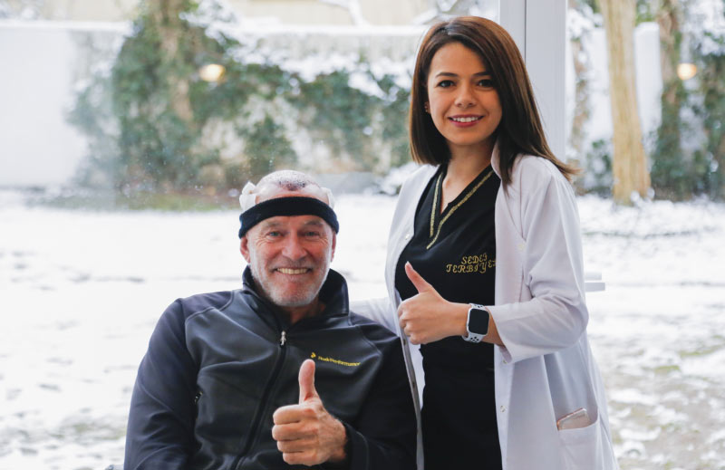 A happy patient and his doctor after hair transplant with Mcan Health 