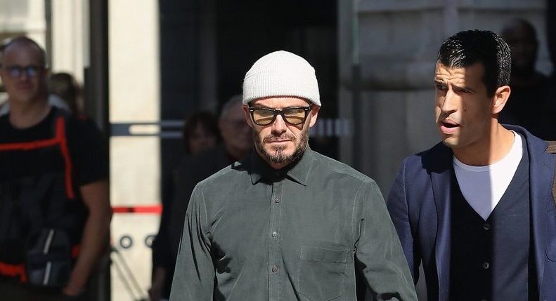 David Beckham after hair transplant covering his head