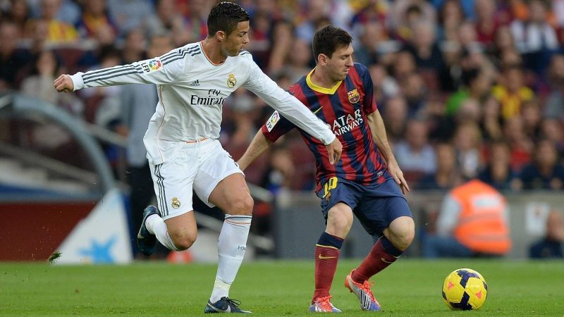 Cristiano Ronaldo and messi tackling in socer 