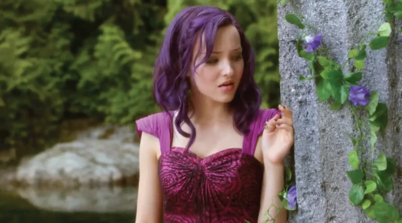 Dove Cameron in a scene of the movie descendants with hair dyed in purple
